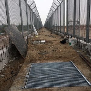 Inside and narrow view of the high BRC fencing coupled with concertina-wire under construction in Singapore