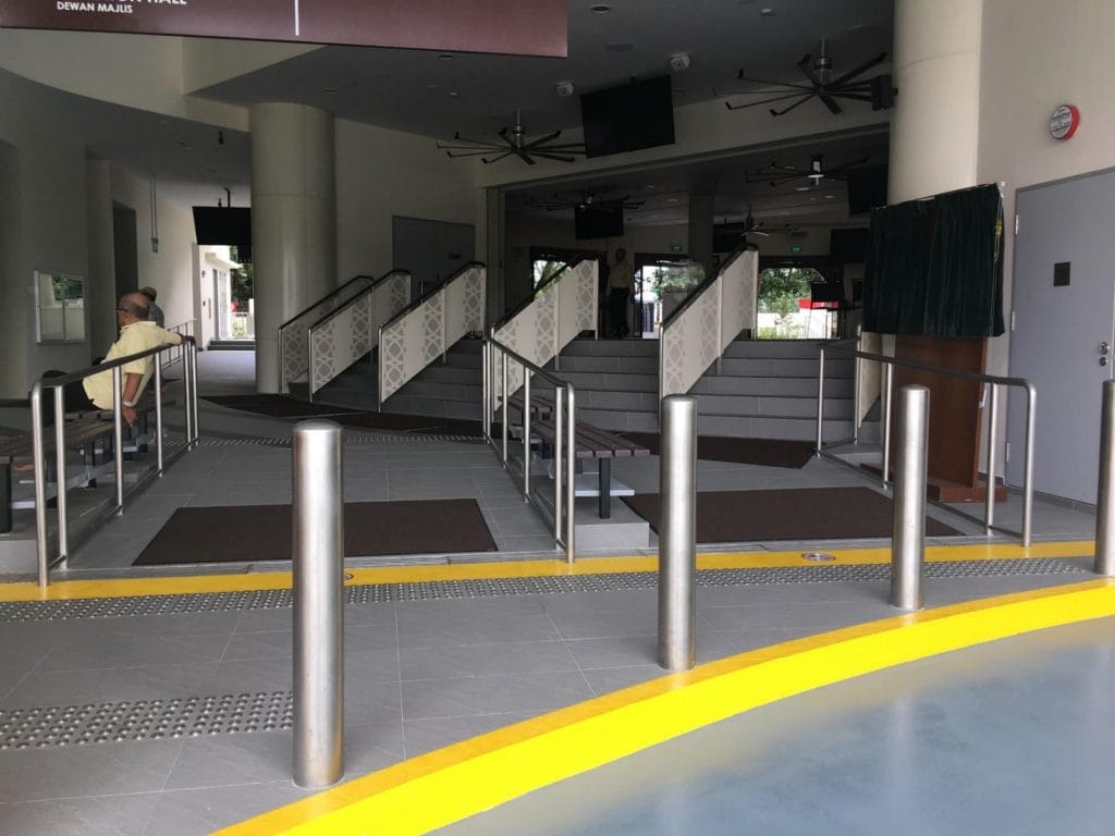 Singapore building with ramp, steps and bollards designed in stainless steel fabrication