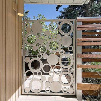 Beautiful stainless steel single leaf outdoor gate with circular patterns from top stainless steel Fabricator Singapore
